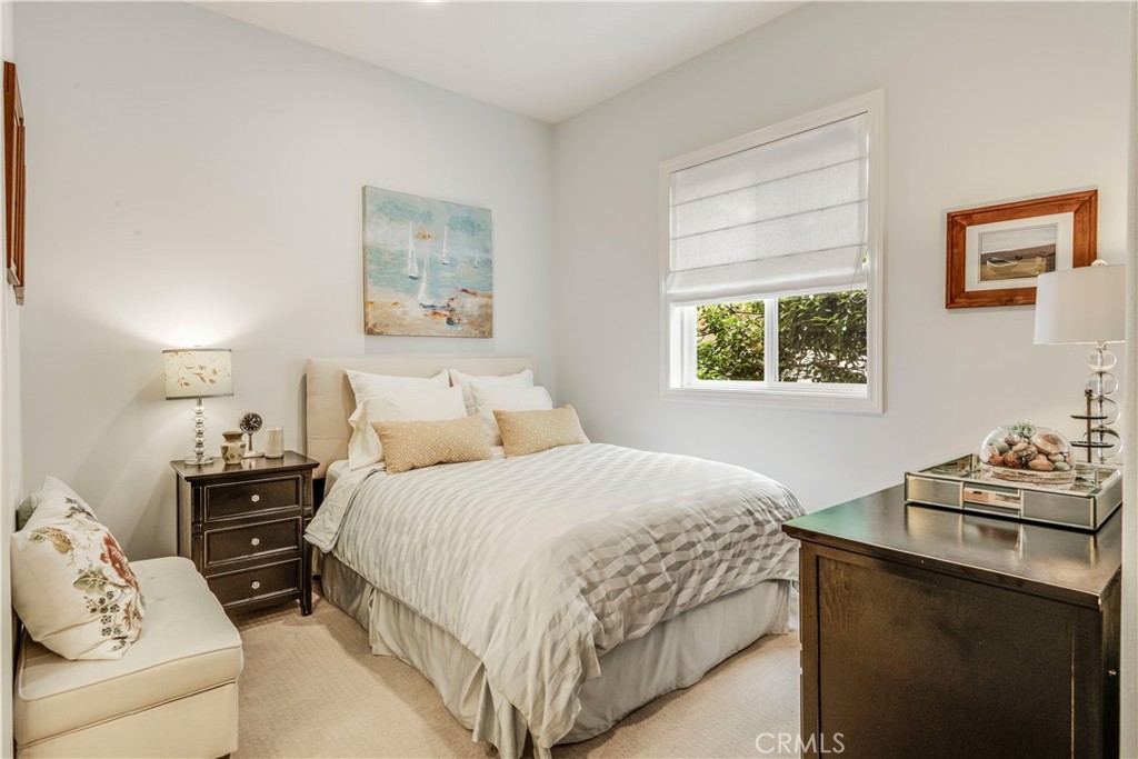 520 Esplanade, Unit D Redondo Beach, CA 90277 - Photo 20 of 24 a bedroom with a bed and two windows