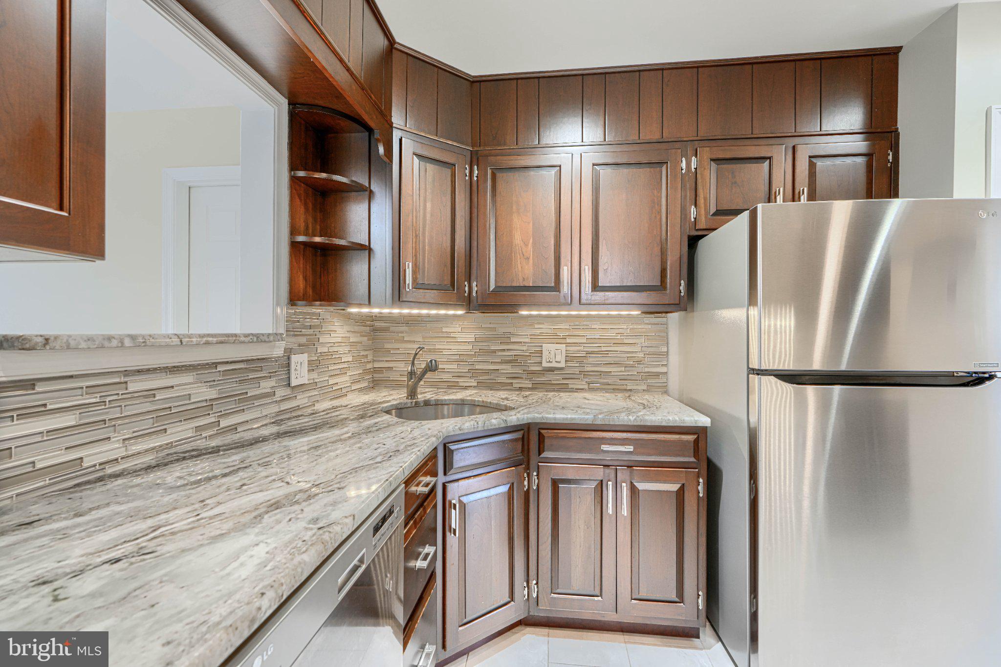 8 Felton Road Lutherville-Timonium, MD 21093 - Photo 21 of 42 Elegant kitchen with rich wood tones.