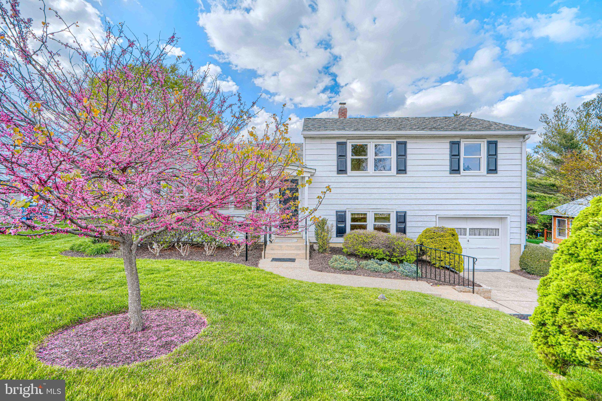 8 Felton Road Lutherville-Timonium, MD 21093 - Photo 3 of 42 Charming home with vibrant blooms.