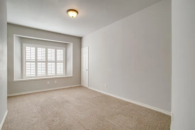 an empty room with windows and window