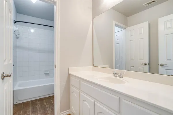 a bathroom with a sink and a bathtub