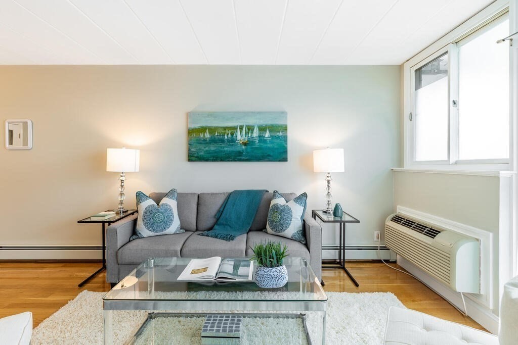 a living room with furniture and a table