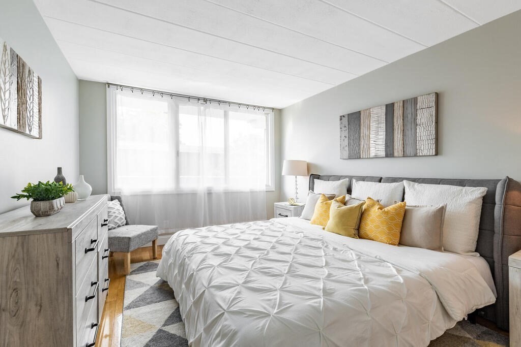 345 Harvard Street, Unit 3C Cambridge, MA 02138 - Photo 11 of 21 a bedroom with a bed and window