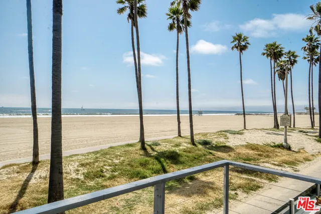 a living room with furniture a large window and a flat screen tv