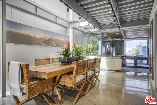 a kitchen with stainless steel appliances granite countertop a refrigerator and a stove