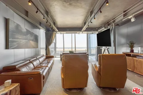 a bedroom with a bed mirror and window