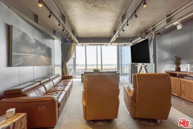 a bedroom with a bed mirror and window