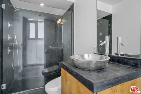 a view of staircase with white walls and a window