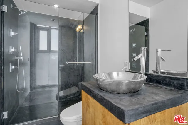 a view of staircase with white walls and a window