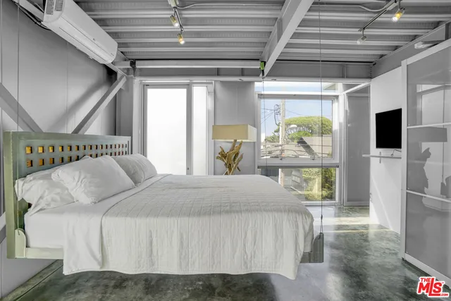 a view of staircase with wooden floor and white walls