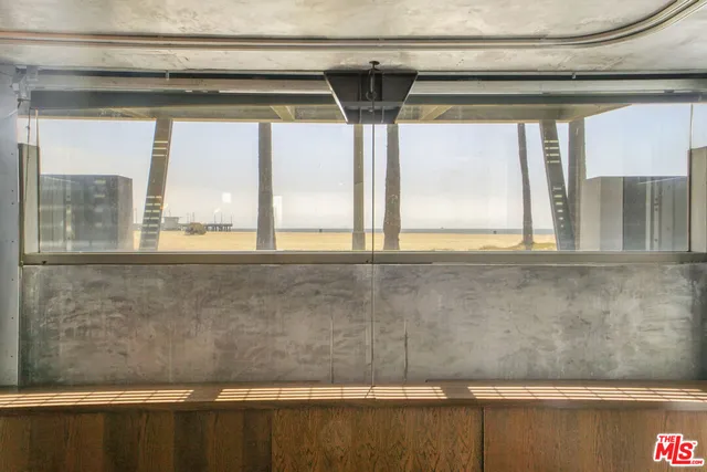 a view of living room with yard and mountain view