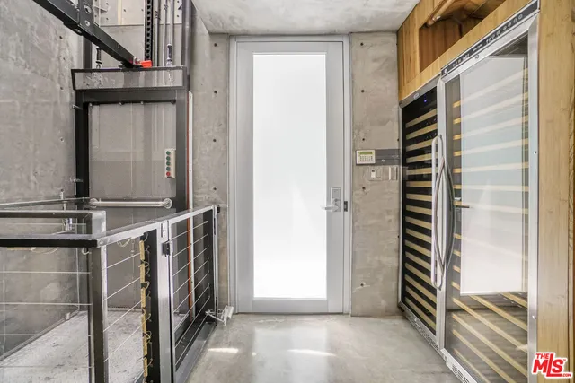 a view of a roof deck with couches and potted plants