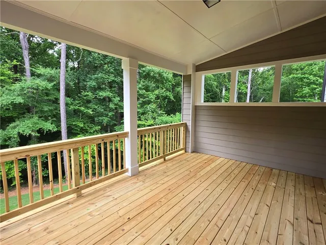 a view of balcony with wooden floor