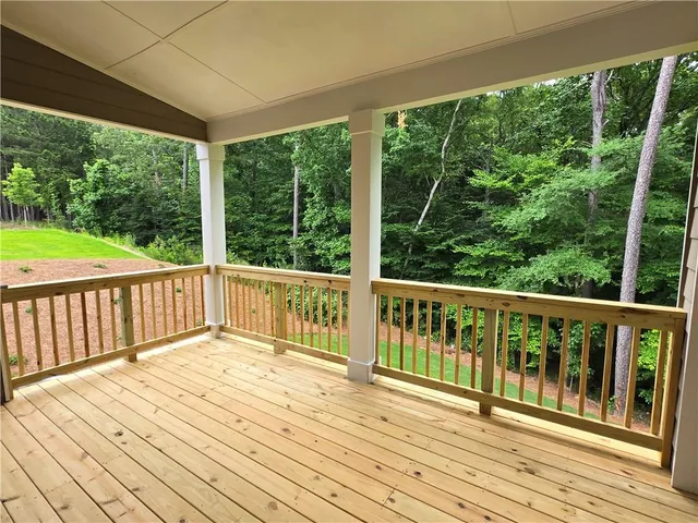 a view of balcony with wooden floor