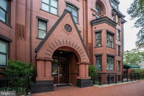 a front view of a building with garden