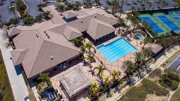 an aerial view of a house with a yard