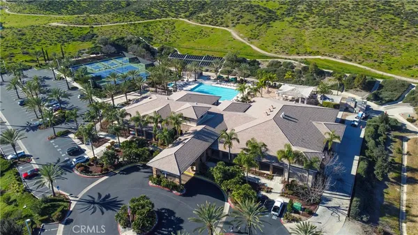 an aerial view of a house with a swimming pool