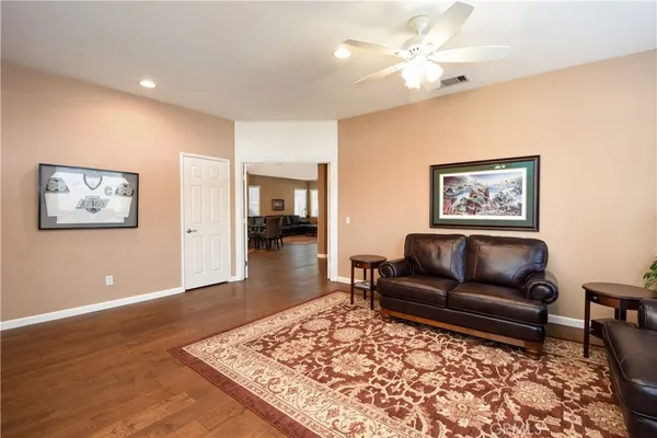 a living room with furniture and a rug