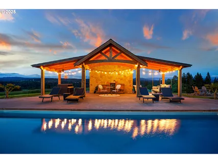 a view of swimming pool with outdoor seating