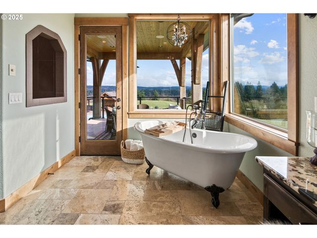 a living room with a large window and a table