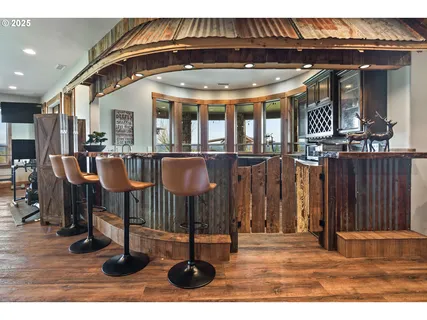 a view of a patio with table and chairs