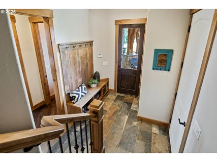 a view of an entryway with wooden floor