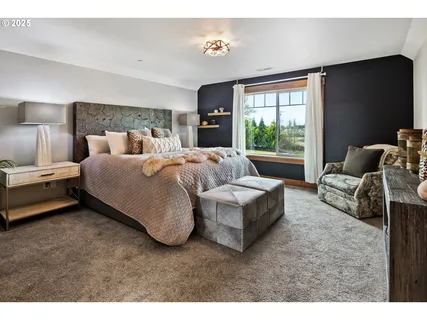 a bedroom with bed and window