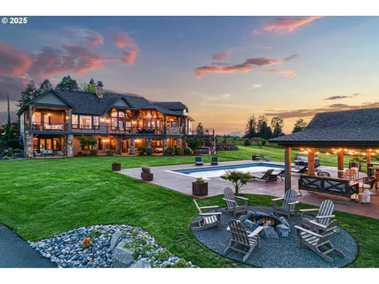 a view of house with backyard and entertaining space