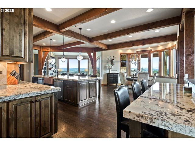 a open kitchen with a table and chairs