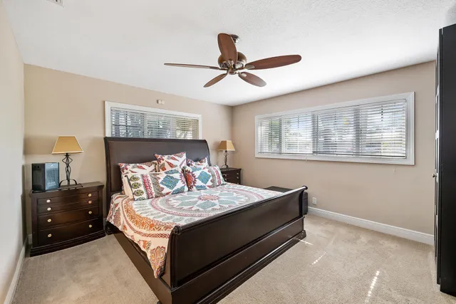 a living room with a bed furniture and a window