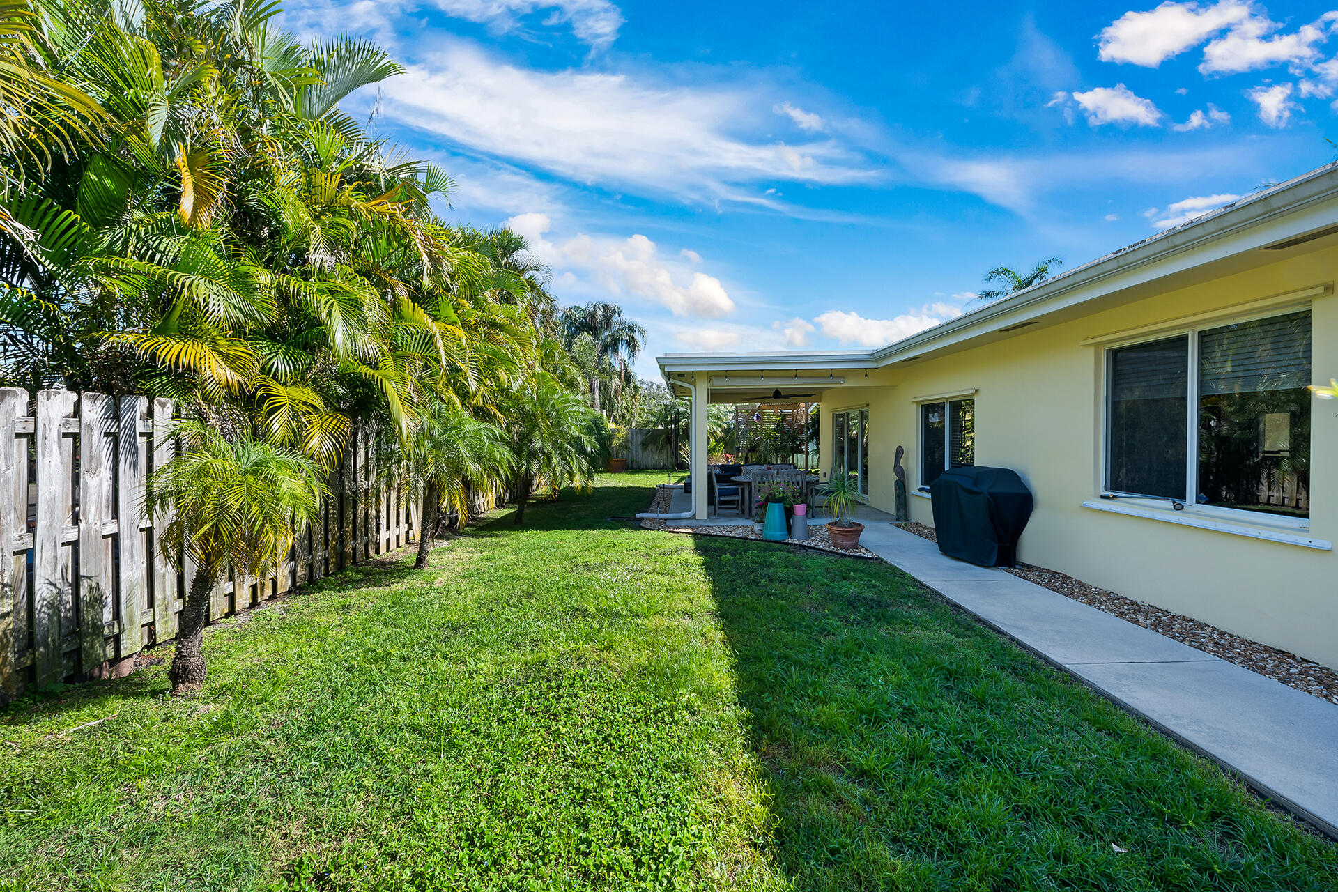2251 Northeast 37th Court Lighthouse Point, FL 33064 - Photo 20 of 26 a view of a porch and garden