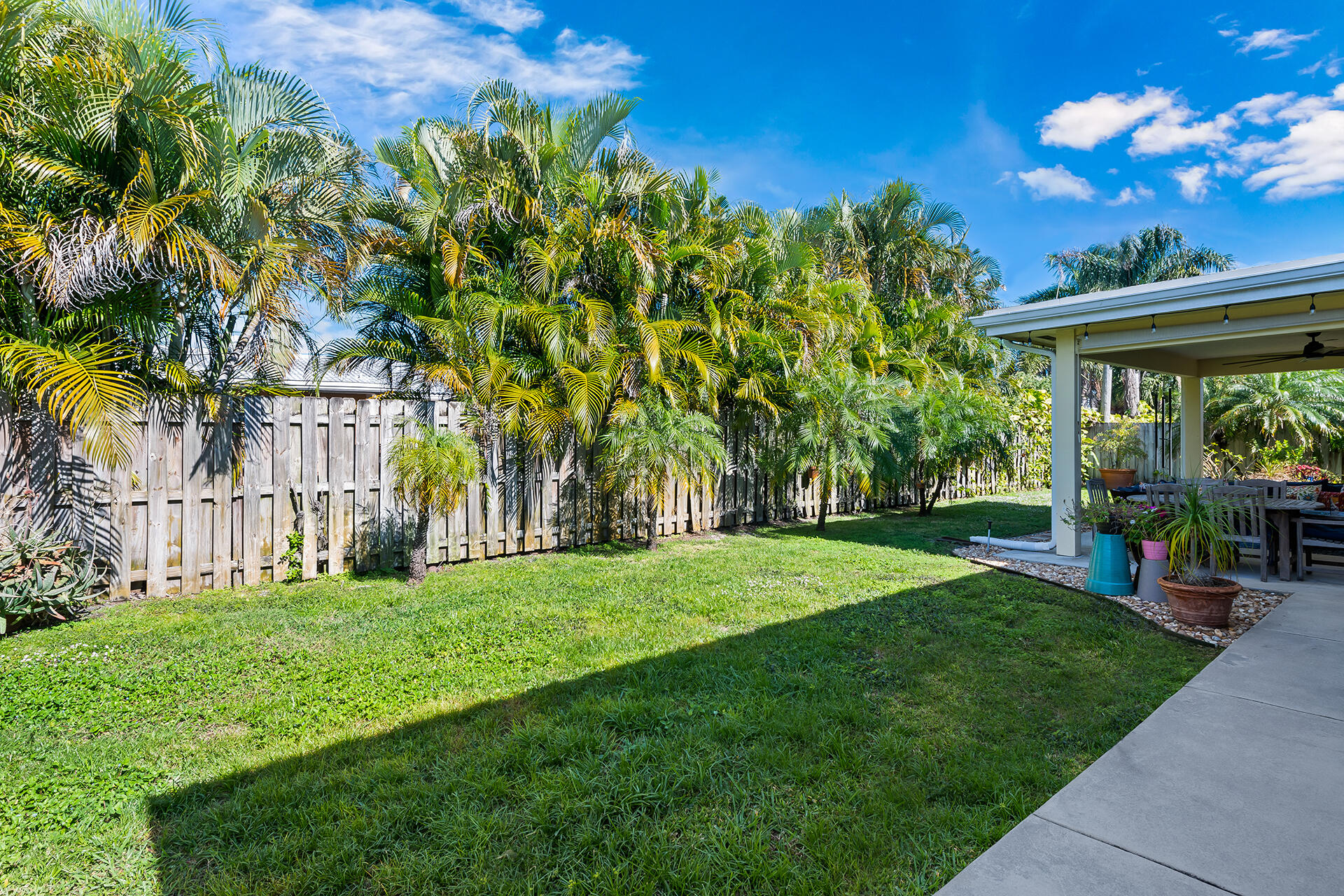 2251 Northeast 37th Court Lighthouse Point, FL 33064 - Photo 21 of 26 a view of a backyard with a garden