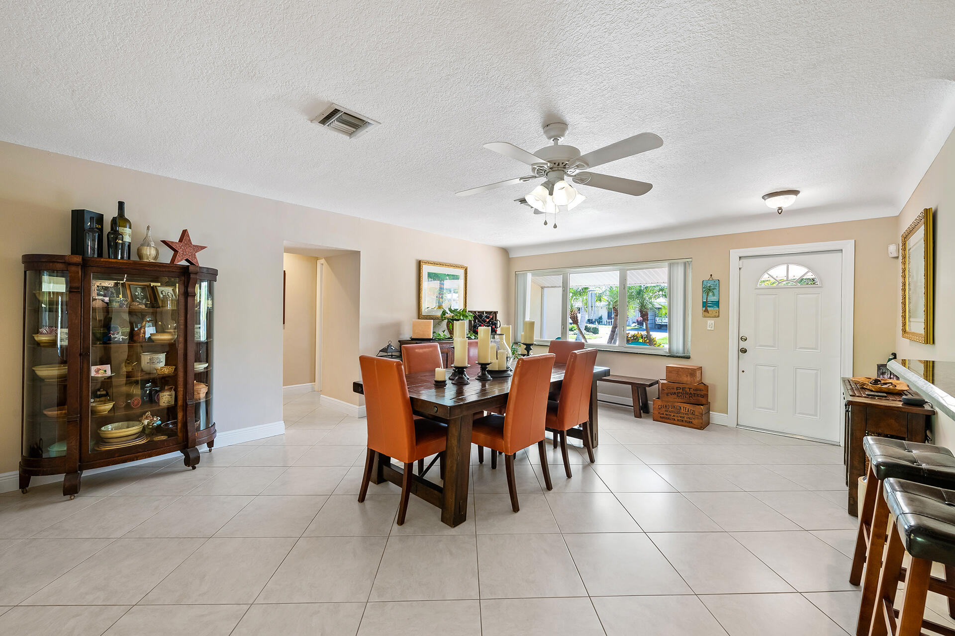 2251 Northeast 37th Court Lighthouse Point, FL 33064 - Photo 3 of 26 a view of a dining room with furniture and chandelier