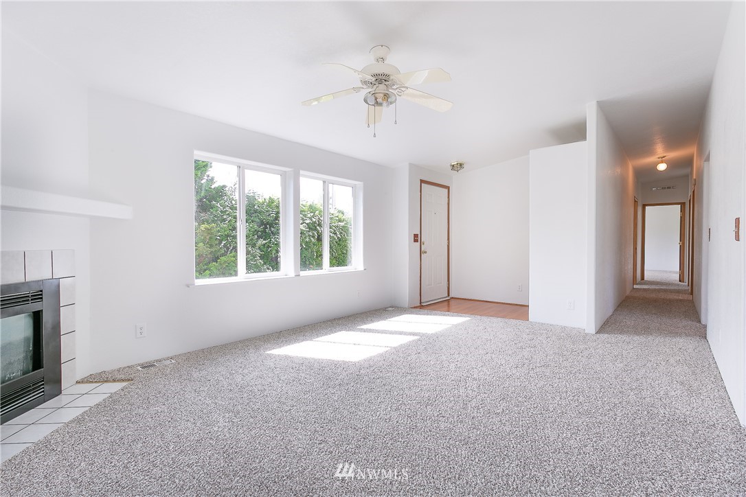 9690 Delta Line Road Blaine, WA 98230 - Photo 3 of 38 a view of a livingroom with a ceiling fan and window