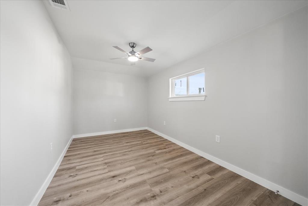 11630 Rupley Lane Dallas, TX 75218 - Photo 24 of 30 an empty room with a window