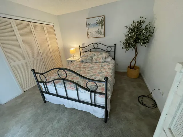 a view of staircase with white walls