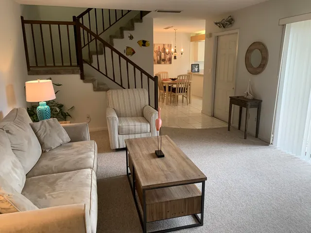 a living room with furniture and a table