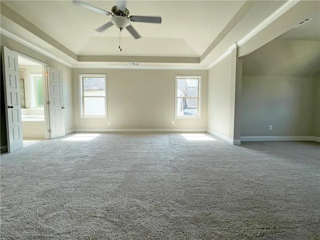 a view of empty room with windows