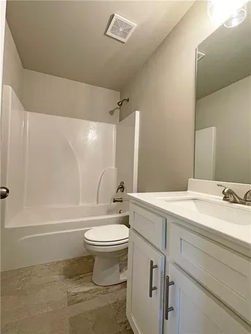 a bathroom with a sink a toilet and a bathtub