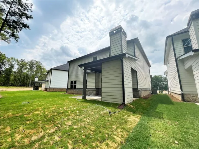 a backyard of a house with lots of green space