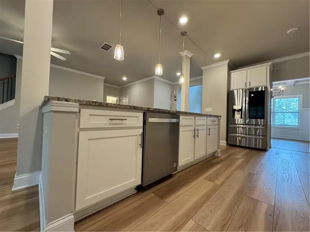 a view of a kitchen with electric appliances