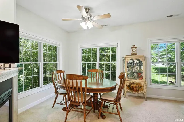 a view of a dining room with furniture window and outside view