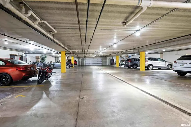 a view of parking area with parked cars