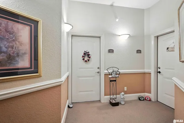 a view of a hallway with workspace