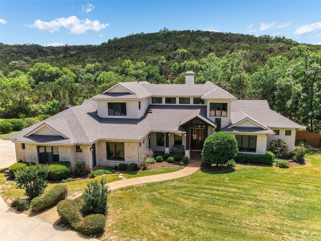 5605 Standing Rock Drive Austin, TX 78730 - Photo 1 of 1 a front view of a house with a yard