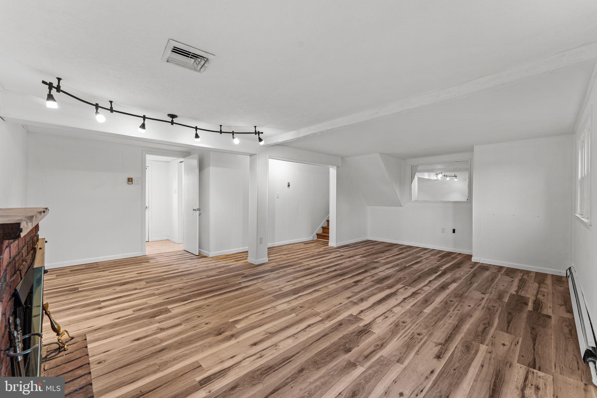 1687 Rupert Road Pottstown, PA 19464 - Photo 24 of 33 a view of empty room with wooden floor and fan