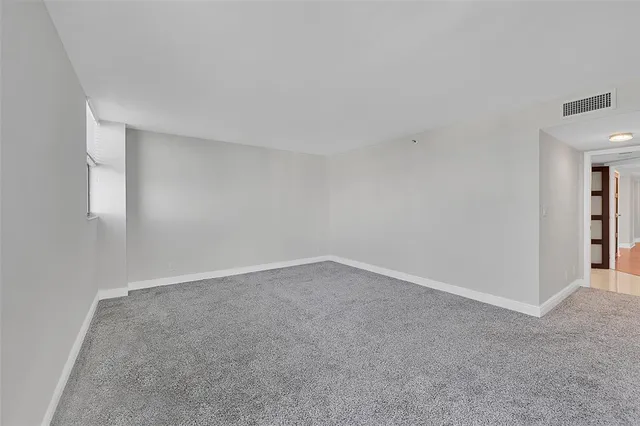 a bathroom with a sink shower and a mirror