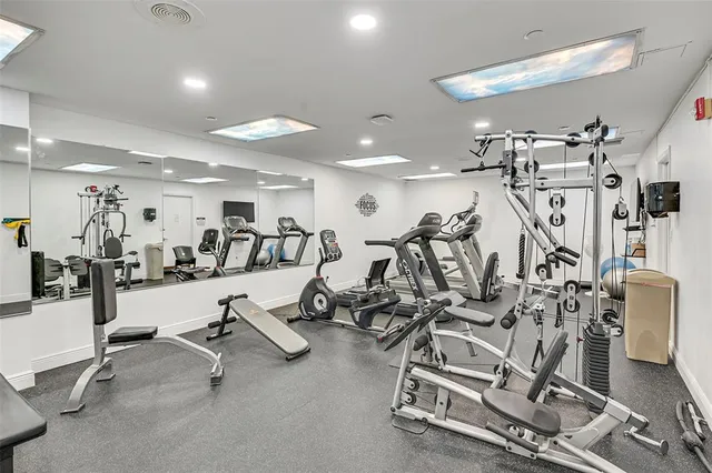 a backyard of a house with a garden and outdoor seating