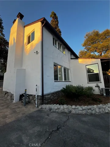 a large kitchen with a stove top oven