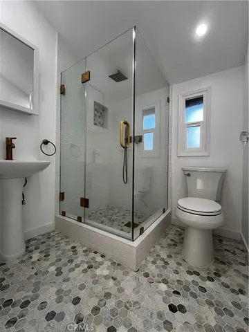 a view of an empty room and wooden floor